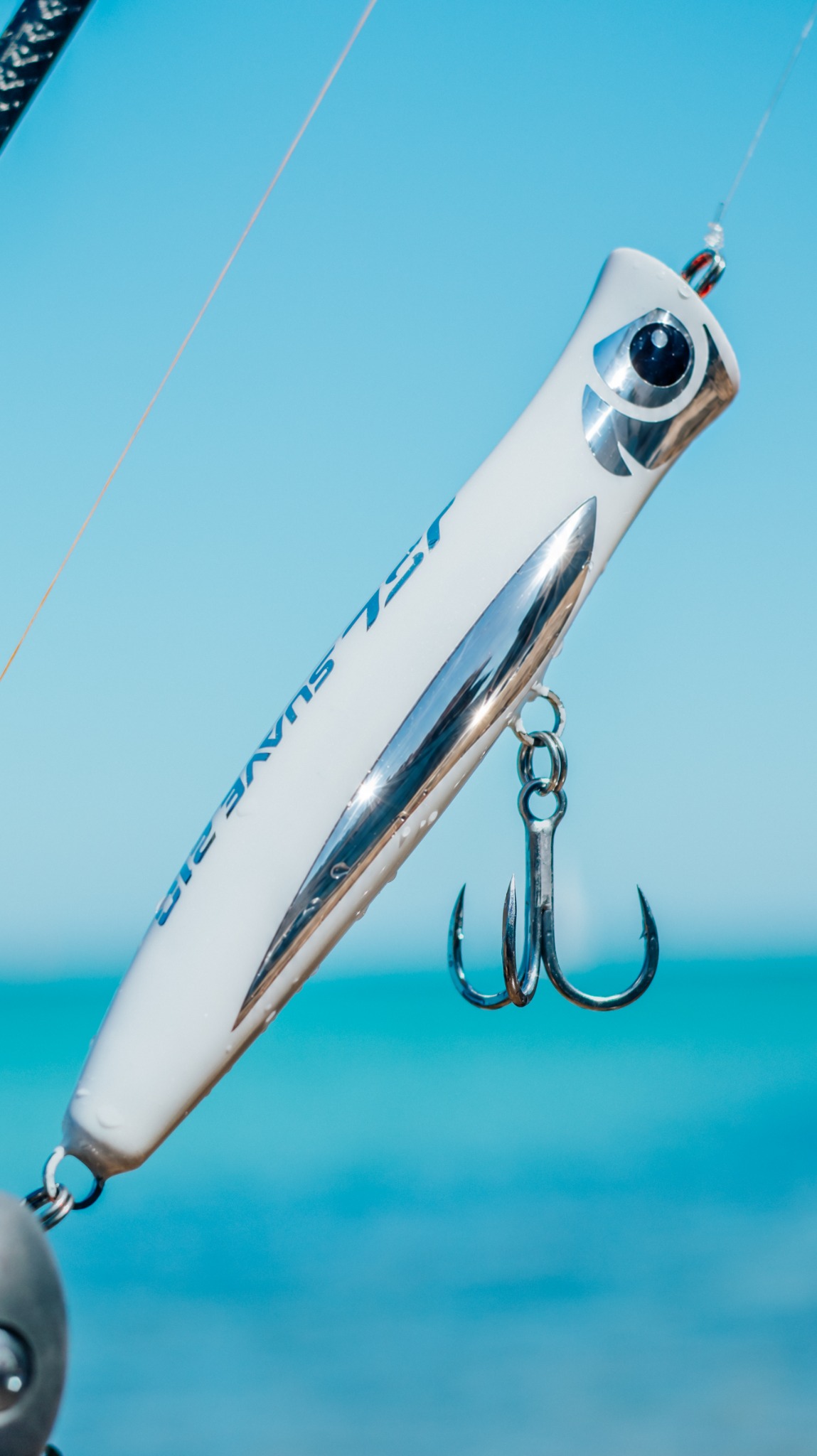 White Ghost Suave 210 hanging against a blue sky