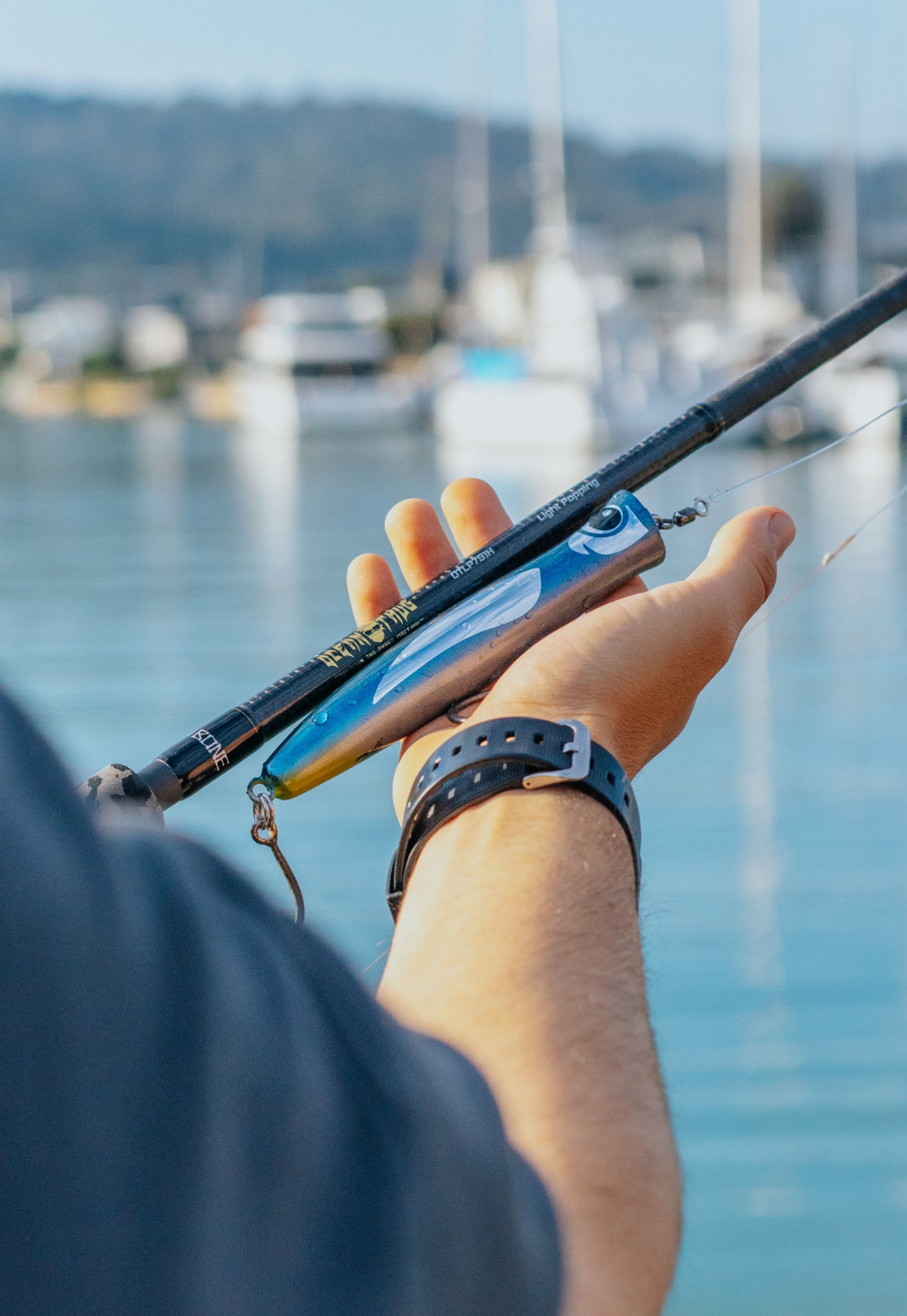 JSL Suave 150 topwater lure in hand